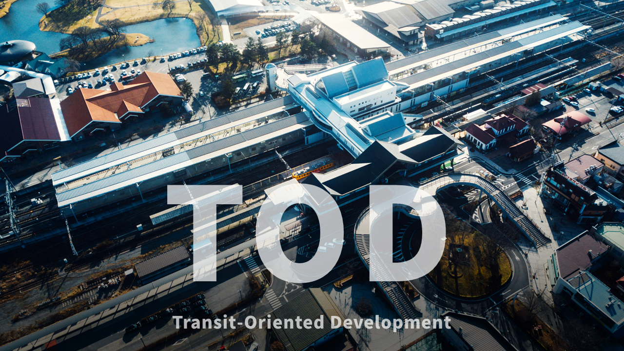 捷運車站為中心的都市空間開發空拍圖，展現TOD（Transit-Oriented Development）模式下的人本交通與聚落整合